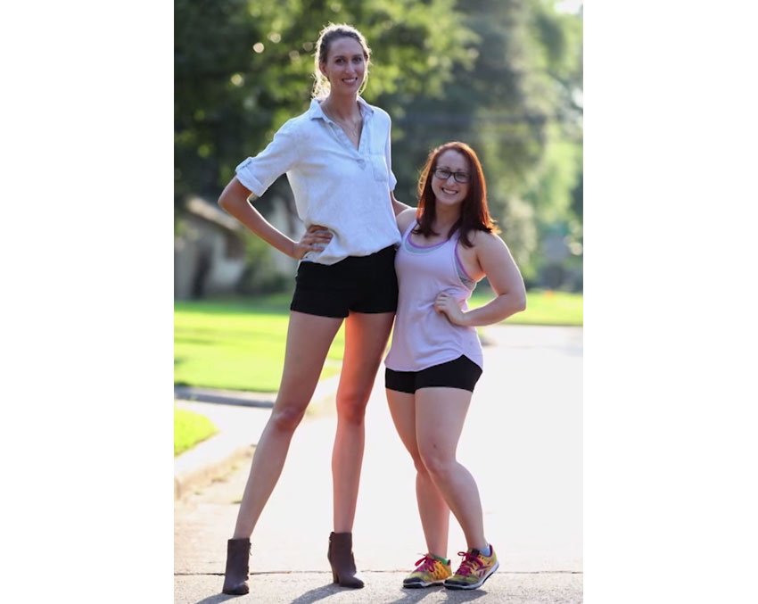 Two women, one of tall stature and one of short stature.